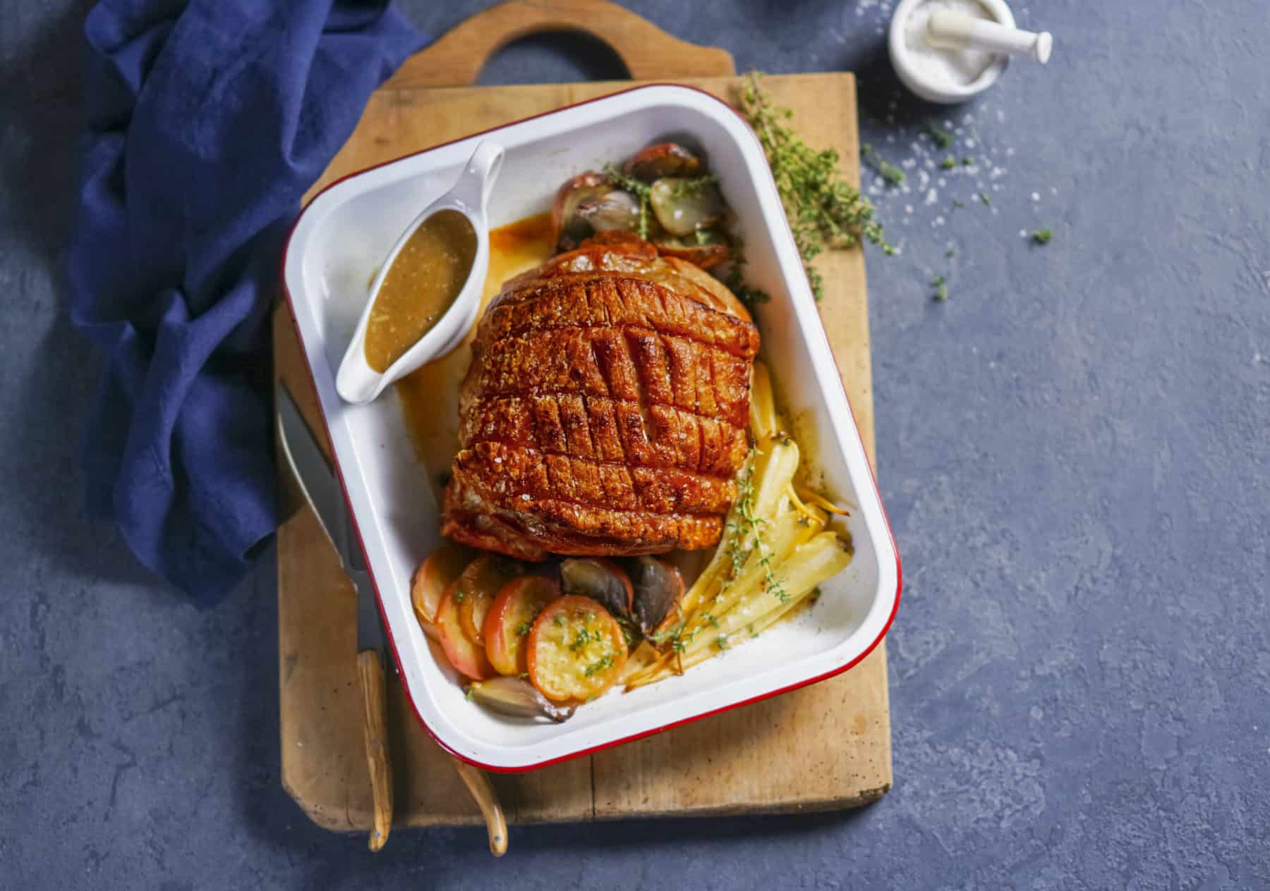 Garlic roast pork with caramelised apples & parsnips