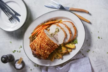 Roast pork leg with cherry & almond couscous stuffing