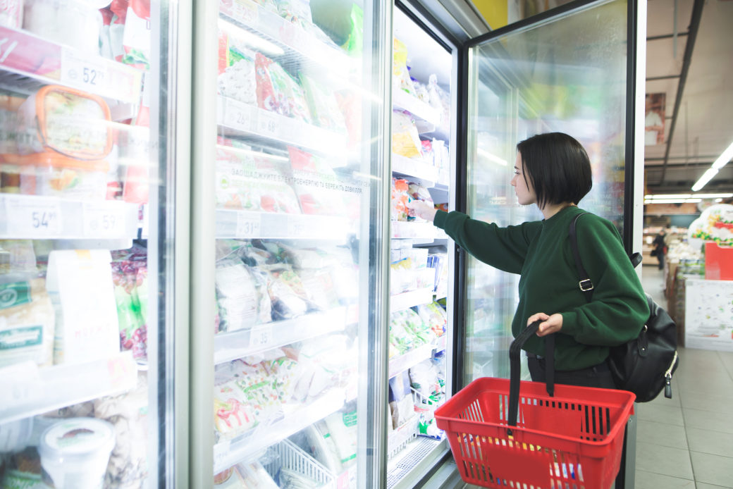Person shopping in frozen aisle